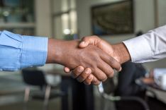 win business. Two people shaking hands