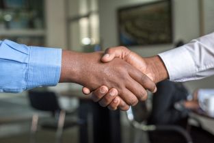 win business. Two people shaking hands
